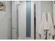 Modern shower featuring sleek glass doors and stylish blue and white tiling at 601 E Winter Dr, Phoenix, AZ 85020