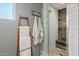 Stylish bathroom featuring a glass shower with rustic wood paneling and white subway tile at 601 E Winter Dr, Phoenix, AZ 85020