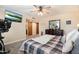 Relaxing bedroom with a TV, hardwood floors, and comfortable bed, perfect for unwinding after a long day at 601 E Winter Dr, Phoenix, AZ 85020