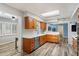Bright kitchen with a skylight features wooden cabinetry, stainless steel appliances, and light countertops at 601 E Winter Dr, Phoenix, AZ 85020