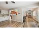 Open-concept living room boasts hardwood floors, built-in cabinets, and seamless flow into the adjacent kitchen and dining areas at 601 E Winter Dr, Phoenix, AZ 85020