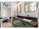 Beautifully designed bathroom featuring a double sink vanity and a view into the adjacent bedroom at 6209 E Bramble Berry Ln, Cave Creek, AZ 85331