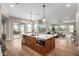 Spacious kitchen island seamlessly connects to the living room and outdoor patio for entertaining at 6209 E Bramble Berry Ln, Cave Creek, AZ 85331