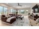 Spacious living room with hardwood floors, stylish decor, large windows, and comfortable seating at 6209 E Bramble Berry Ln, Cave Creek, AZ 85331
