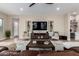 Comfortable living room featuring hardwood floors, modern decor, and ample natural light at 6209 E Bramble Berry Ln, Cave Creek, AZ 85331