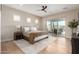 Serene main bedroom with a ceiling fan, an area rug, and access to the outdoor pool area at 6209 E Bramble Berry Ln, Cave Creek, AZ 85331