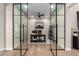 Office with glass doors and a ceiling fan, offering a modern workspace at 6209 E Bramble Berry Ln, Cave Creek, AZ 85331