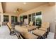 Inviting outdoor patio with comfortable seating, a ceiling fan, and access to the backyard at 6209 E Bramble Berry Ln, Cave Creek, AZ 85331