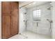 Elegant glass-enclosed shower with marble accents and dual showerheads in the bathroom at 6209 E Bramble Berry Ln, Cave Creek, AZ 85331