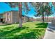 Beautiful community grounds featuring manicured lawns, mature trees, and inviting walkways between buildings at 623 W Guadalupe Rd # 214, Mesa, AZ 85210
