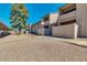 Exterior view of the apartment complex showcasing its well-maintained grounds, carport, and walkways at 623 W Guadalupe Rd # 214, Mesa, AZ 85210