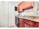 Beautiful kitchen featuring modern appliances, wood cabinets, granite countertops and a double stainless sink at 623 W Guadalupe Rd # 214, Mesa, AZ 85210