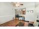 Inviting living room with wood floors, seamlessly connected to the dining area and kitchen at 623 W Guadalupe Rd # 214, Mesa, AZ 85210