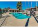 Community pool area featuring a refreshing pool, shaded seating, and lounge chairs for resident enjoyment at 623 W Guadalupe Rd # 214, Mesa, AZ 85210
