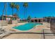A sparkling community pool and spa with lounge chairs offer a relaxing oasis for residents at 623 W Guadalupe Rd # 214, Mesa, AZ 85210