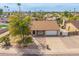 Aerial view of a well-maintained home with a lush front yard and inviting curb appeal at 6608 S Willow Dr, Tempe, AZ 85283