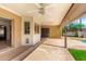 Covered back patio featuring ceiling fans and offering an ideal spot for relaxing and enjoying the outdoors at 6608 S Willow Dr, Tempe, AZ 85283