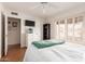 Comfortable bedroom is equipped with a television and modern ceiling fan at 6608 S Willow Dr, Tempe, AZ 85283