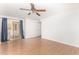Bedroom with hardwood floors and sliding door to the patio at 6608 S Willow Dr, Tempe, AZ 85283