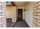 Covered entryway featuring brick columns and a secure, decorative security screen door at 6608 S Willow Dr, Tempe, AZ 85283