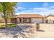 Charming single-story home with a well-manicured front yard and inviting curb appeal under a blue sky at 6608 S Willow Dr, Tempe, AZ 85283