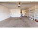 Spacious two car garage offers ample storage with built in shelving and a clean epoxy floor at 6608 S Willow Dr, Tempe, AZ 85283