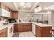 Well-lit kitchen featuring ample counter space, tiled floor, and bright natural lighting at 6608 S Willow Dr, Tempe, AZ 85283