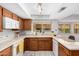 Functional kitchen with white appliances, ample counter space, and wood cabinets at 6608 S Willow Dr, Tempe, AZ 85283