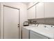 Functional laundry room with modern washer and dryer units at 6608 S Willow Dr, Tempe, AZ 85283
