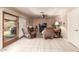 Bright living room features tile floor, ceiling fan, and sliding door to patio and backyard at 6608 S Willow Dr, Tempe, AZ 85283