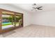 Bright sunroom with tile flooring, ceiling fan, and sliding door to a private pool area at 6608 S Willow Dr, Tempe, AZ 85283
