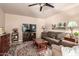 Inviting living room features a comfortable sofa, ceiling fan, and stylish rug at 6608 S Willow Dr, Tempe, AZ 85283