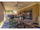 Covered outdoor patio with a built-in grill and ceiling fan, perfect for entertaining at 6608 S Willow Dr, Tempe, AZ 85283