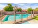 Fenced backyard pool featuring a lounge area and a clear blue swimming pool at 6608 S Willow Dr, Tempe, AZ 85283