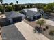 Aerial image of the home with a long driveway and multi-car garages at 8755 E Gary Rd, Scottsdale, AZ 85260