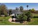 Backyard view with a lush garden, gazebo, swimming pool, and solar panels at 8755 E Gary Rd, Scottsdale, AZ 85260