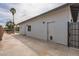 Backyard featuring a covered patio, gate, and a small picnic table on the grass at 8755 E Gary Rd, Scottsdale, AZ 85260