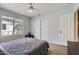 Bedroom featuring a queen-size bed, modern ceiling fan, and a window offering natural light at 8755 E Gary Rd, Scottsdale, AZ 85260