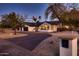 Beautiful single Gathering home with desert landscaping, a three car garage, and mature trees at 8755 E Gary Rd, Scottsdale, AZ 85260