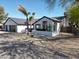 A charming white single-story home with desert landscaping and gray trim at 8755 E Gary Rd, Scottsdale, AZ 85260