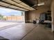 Well-lit garage with ample space, motorcycle, and convenient access to the outdoors at 8755 E Gary Rd, Scottsdale, AZ 85260