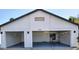 Spacious three-car garage with an immaculate floor and access door at 8755 E Gary Rd, Scottsdale, AZ 85260