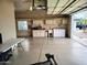 Functional garage with laundry area, cabinets, and workspace for various activities at 8755 E Gary Rd, Scottsdale, AZ 85260