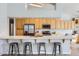 This kitchen features an extended island with bar seating and stainless steel appliances including a refrigerator at 8755 E Gary Rd, Scottsdale, AZ 85260