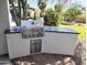 Modern outdoor grill with stainless steel finish and stone countertop in landscaped backyard at 8755 E Gary Rd, Scottsdale, AZ 85260
