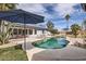 Beautiful pool area with umbrellas, lounge chairs and covered patio, perfect for outdoor entertaining at 8755 E Gary Rd, Scottsdale, AZ 85260