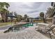 Inviting pool area featuring lounge chairs, umbrellas, lush landscaping, and a charming gazebo at 8755 E Gary Rd, Scottsdale, AZ 85260