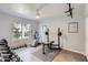 Functional workout room featuring an exercise bike, weights, and a ceiling fan for added comfort at 8755 E Gary Rd, Scottsdale, AZ 85260