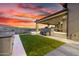 Well-appointed backyard with artificial turf, outdoor seating, and stunning sunset views at 9127 N Fireridge Trl, Fountain Hills, AZ 85268