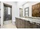 A stunning bathroom features a luxurious shower with decorative tile and a spacious vanity at 9127 N Fireridge Trl, Fountain Hills, AZ 85268